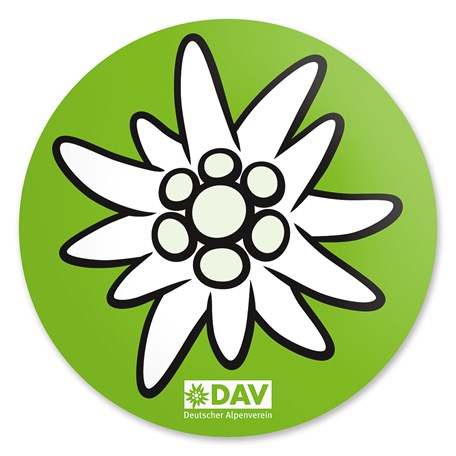 runder Aufkleber mit weißem Edelweiß und grünem Hintergrund